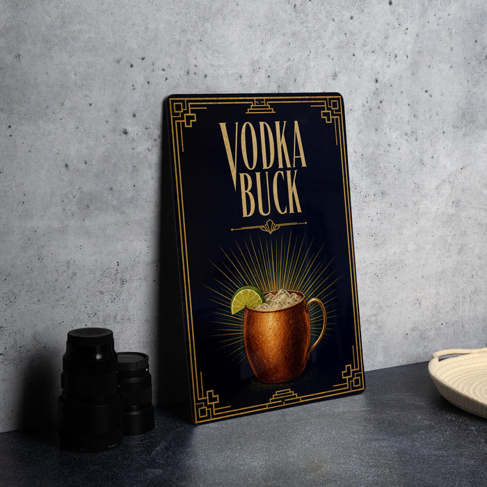 A black and gold advertisement for vodka called "Vodka Buck" featuring an illustration of a copper mug with a drink inside.