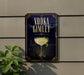 a sign with the text "VODKA GIMLET" and an illustration of a martini glass with a lime wedge.