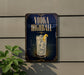 a sign advertising a vodka highball cocktail, with a glass of the cocktail and a lemon slice prominently displayed.