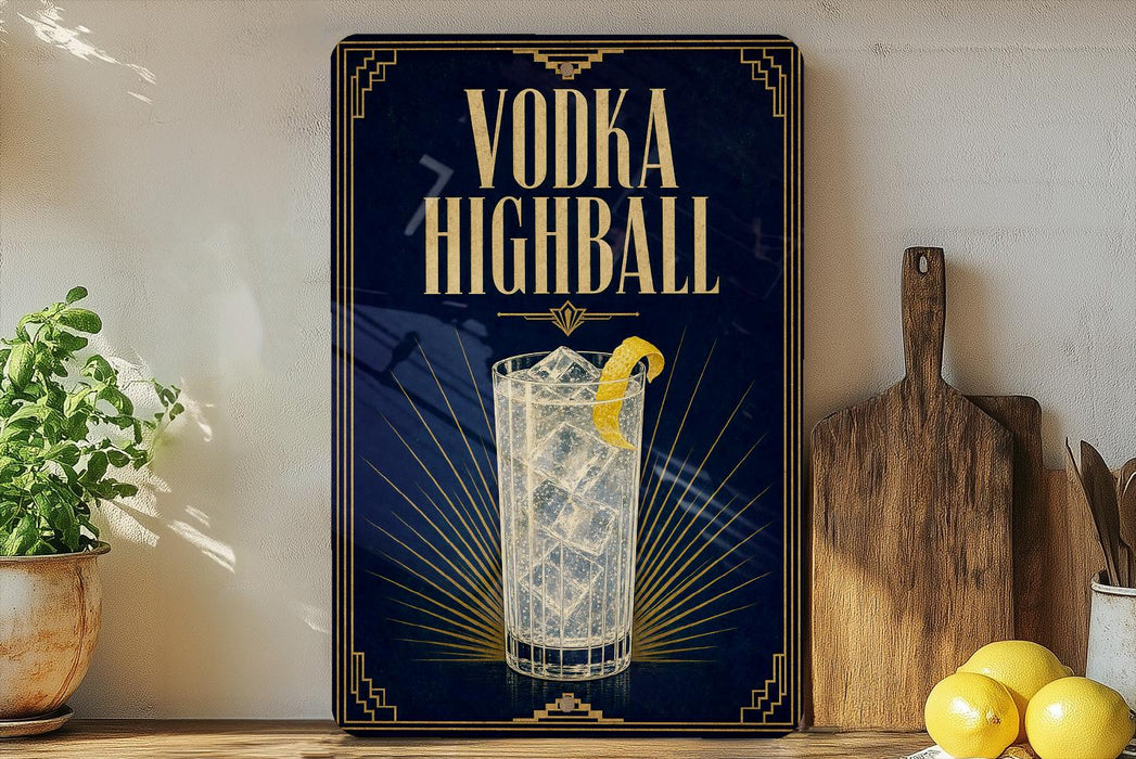 A framed advertisement for vodka highball, featuring a glass of highball cocktail with a lemon slice, placed on a wooden shelf next to a wooden cutting board and a potted plant.