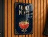A sign for a vodka punch, featuring an illustration of a glass filled with a red-colored drink and garnished with a lemon slice.