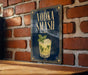 a sign with the text "VODKA SMASH" and an illustration of a cocktail, likely a vodka-based drink.