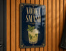 A sign with the text "VODKA SMASH" and an illustration of a cocktail on a dark background.