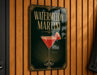 A sign for a watermelon martini is displayed on a wooden wall.