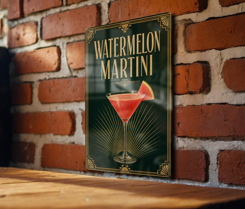 A sign for a "Watermelon Martini" is displayed on a brick wall, featuring a glass of the cocktail with a slice of watermelon.