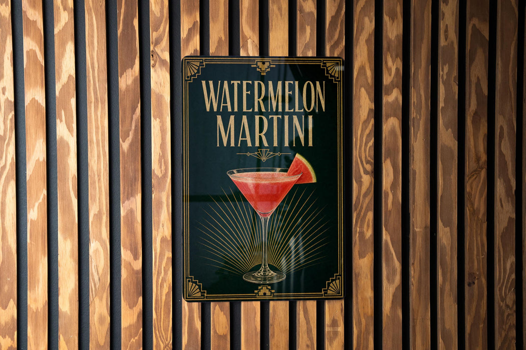 A sign for a watermelon martini is displayed on a wooden wall.
