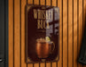 A sign that reads "Whiskey Buck" is hanging on a wooden wall.