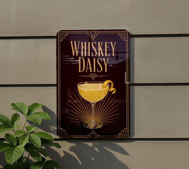 A sign for a whiskey daisy cocktail is displayed on a wall, featuring a glass of the drink with a lemon twist.