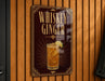 A sign for whiskey ginger cocktail hangs on a wooden wall.