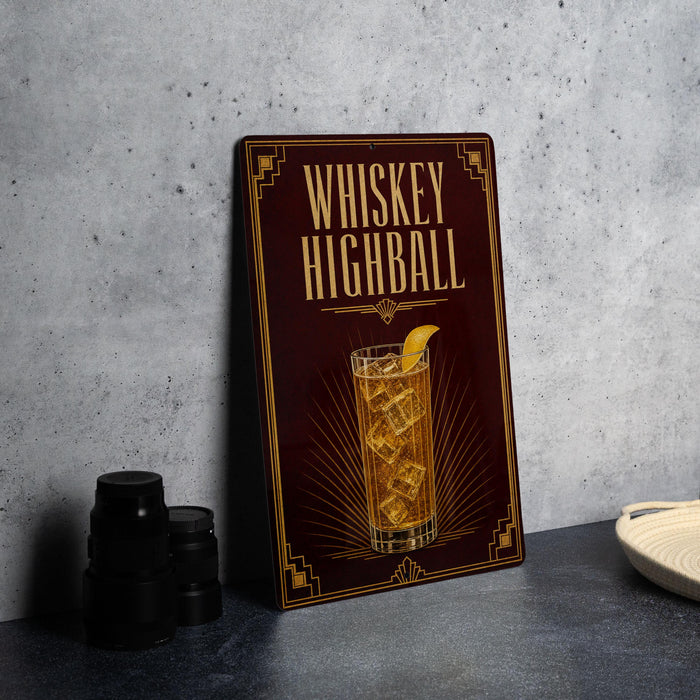 A framed advertisement for whiskey highball, featuring an illustration of a whiskey highball glass with ice cubes.