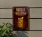 A sign for whiskey highball, featuring an illustration of a whiskey glass with ice cubes and a lemon slice.