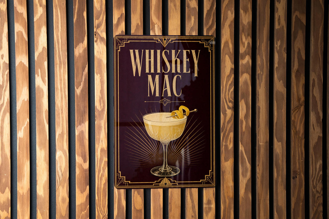 A sign for "Whiskey Mac" is displayed on a wooden wall.