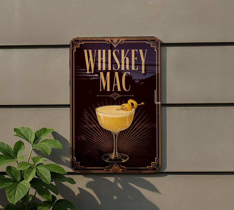 A sign for "Whiskey Mac" is displayed on a wall, featuring an illustration of a whiskey glass with a lemon twist.