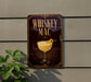 A sign for "Whiskey Mac" is displayed on a wall, featuring an illustration of a whiskey glass with a lemon twist.