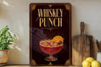 A framed poster with the text "WHISKEY PUNCH" and an illustration of a cocktail with a lemon slice.