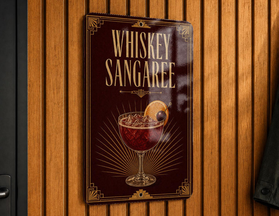 A sign for whiskey sangaree hangs on a wooden wall, featuring an illustration of a glass containing a red-colored drink with a lemon slice.