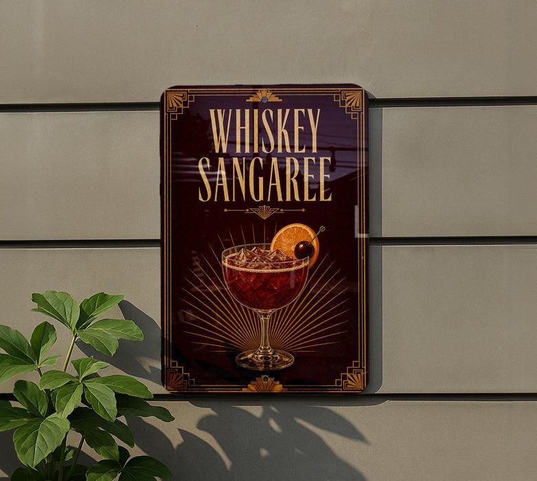 A sign advertising whiskey sampree cocktails is displayed on a wall, with a plant visible to the left.