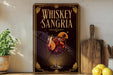 A framed advertisement for whiskey-sangria, featuring a glass of the cocktail with a garnish and a decorative border.