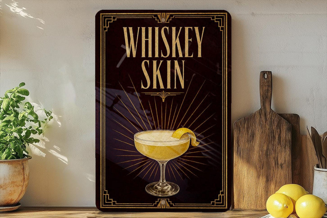 A framed poster with the text "WHISKEY SKIN" and an illustration of a cocktail on a wooden shelf.