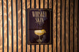 A sign with the text "Whiskey Skin" and an illustration of a cocktail glass with a lemon slice.