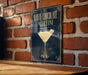A poster advertising a "White Chocolate Martini" is displayed on a brick wall.