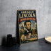 A vintage-style metal sign featuring the portrait of Abraham Lincoln, with text indicating the location as the National Heritage Area of Illinois.