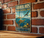 A vintage-style metal sign for the Abrolhos Marine National Park in Brazil, featuring an illustration of a turtle, fish, and coral reef.
