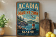 A vintage-style metal sign for Acadia National Park's Marine Zone, featuring a scenic image of a lighthouse and a rocky coastline.