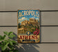 a vintage-style metal sign with the text "ACROPOLIS of ATHENS GREECE" and an illustration of the Acropolis in Athens, Greece.