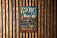 A vintage metal sign for Agedcroft Hall in Virginia, featuring a traditional Tudor-style house surrounded by a garden.