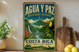 a vintage-style sign for the Agua y Paz Biosphere Reserve in Costa Rica, with a tropical landscape and a toucan bird.