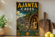 A vintage-style poster advertising Ajanta Caves in India, featuring a scenic image of the ancient rock carvings and a Buddha statue.