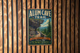 A vintage-style metal sign for the Alum Cave Trail in the Great Smoky Mountains National Park, Tennessee, hanging on a wooden wall.