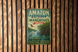 A vintage-style metal sign with the text "AMAZON ESTUARY AND ITS MANGROves BRASIL" is displayed on a wooden wall.