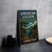 A vintage metal sign for the American Legion State Forest in Connecticut, featuring a scenic landscape with pine trees and a lake.