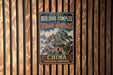a vintage-style sign advertising the Wudang Mountains in China, with a temple and mountains depicted in the background.