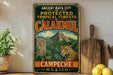 A vintage metal sign advertising the ancient city of Calakmul, Mexico, featuring a jungle scene with a jaguar and a pyramid.