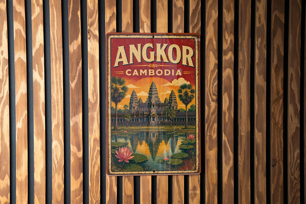 A vintage-style metal sign with the text "ANGKOR CAMBODIA" and an illustration of the Angkor Wat temple complex in Cambodia.