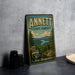 A vintage metal sign for the state forest in New Hampshire, featuring a scenic landscape with pine trees, mountains, and a lake.