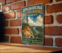 A vintage-style metal sign for the Apalachicola Bluffs & Ravines Preserve in Florida, featuring a scenic landscape with a river and palm trees.