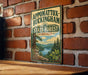 A vintage-style metal sign for Appomattox-Buckingham State Forest in Virginia, featuring a scenic landscape with pine trees, a lake, and mountains.