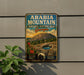 a vintage-style sign for the Arabia Mountain National Heritage Area in Georgia, with a mountain landscape and a cactus plant in the foreground.