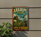 A vintage-style metal sign for Aripipe Park in Brazil, featuring a bird, cactus, and mountains in the background.