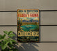 A vintage metal sign with a landscape depicting a desert scene, mountains, and a body of water, mounted on a wall.