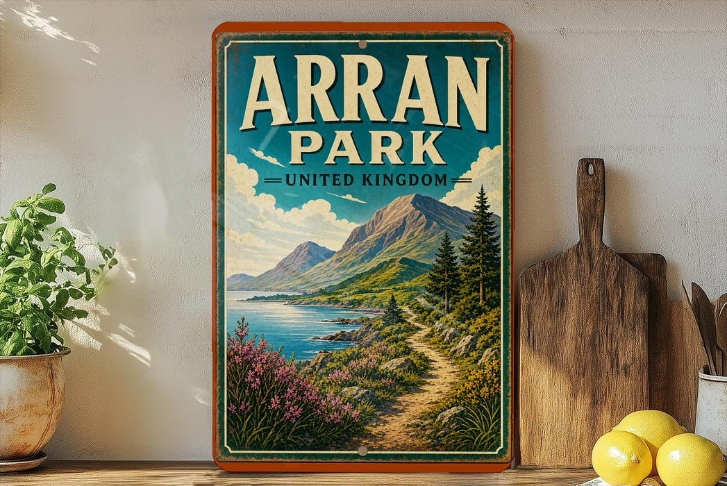 A vintage-style sign for Arran Park, United Kingdom, featuring a scenic mountain landscape with a winding path and a body of water.