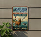 A vintage metal sign for Assateague Island National Seashore, Maryland, featuring a lighthouse, a horse, and seagulls in the ocean.