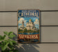 A vintage-style metal sign with the text "Assumption Cathedral and Monastery" and "Svyazhsk Russia" is displayed on a wall, with a plant to the left.