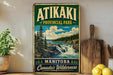 A vintage-style sign for Atikaki Provincial Park in Manitoba, Canada, featuring a scenic landscape with a waterfall and pine trees.