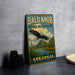 A vintage metal sign for the Bald Knob National Wildlife Refuge in Arkansas, featuring an eagle in flight and a scenic landscape.