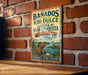 A vintage-style sign for Banados del Rio Dulce, Laguna de Mar Chiquita, and Argentina, featuring an illustration of a beaver and a bird in a natural setting.
